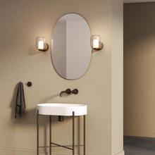 Load image into Gallery viewer, Aquina Bath Wall Light in bathroom.