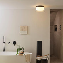 Load image into Gallery viewer, Aquina LED Semi Flush Mount Ceiling Light in bathroom.