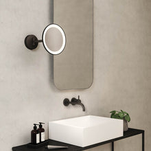 Load image into Gallery viewer, Mascali Round LED Magnifying Mirror in bathroom.