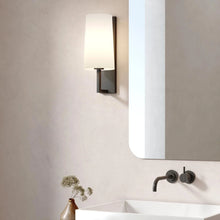 Load image into Gallery viewer, Riva Wall Light in bathroom.