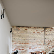 Load image into Gallery viewer, Atlas Wall Light in living room.