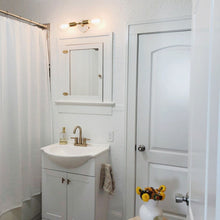 Load image into Gallery viewer, Chloe Wall Light in bathroom.