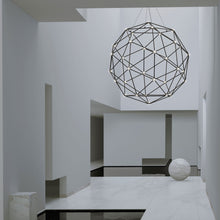 Load image into Gallery viewer, Constellation® Hedron LED Pendant Light in living room.
