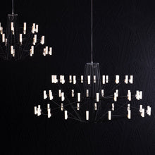 Load image into Gallery viewer, Coppelia LED Chandelier in dining room.