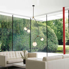 Load image into Gallery viewer, Ivy Vertical Pendant Light in living room.