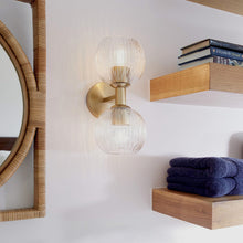 Load image into Gallery viewer, Helios Wall Light in bathroom.
