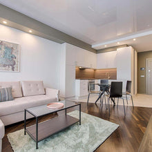 Load image into Gallery viewer, Scope LED Gimble Recessed Light in living room.