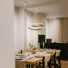 Load image into Gallery viewer, Twist LED Pendant Light in dining room.