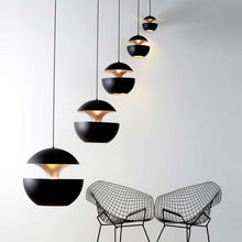 Load image into Gallery viewer, Here Comes the Sun LED Pendant Light in exhibition.