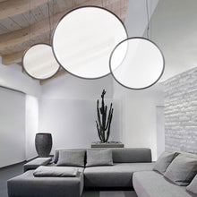 Load image into Gallery viewer, Discovery LED Vertical Suspension Light in living room.