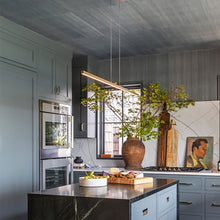 Load image into Gallery viewer, Essence LED Linear Suspension Light in kitchen.