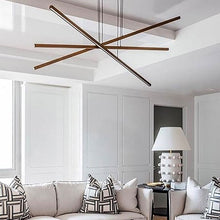 Load image into Gallery viewer, Essence Trio LED Linear Chandelier in living room.