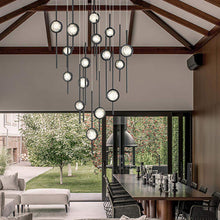 Load image into Gallery viewer, Barletta LED Multi Light Pendant Light in living room.