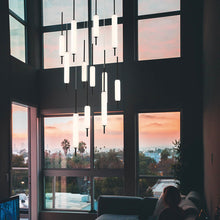 Load image into Gallery viewer, Cumberland Round LED Multi Light Pendant Light in living room.
