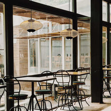 Load image into Gallery viewer, Park LED Pendant Light in restaurant.