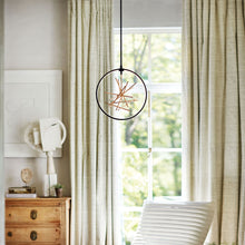 Load image into Gallery viewer, Styx LED Pendant Light in living room.