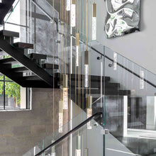 Load image into Gallery viewer, Axis LED Multi Light Pendant Light in living room.