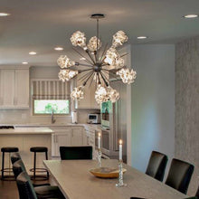 Load image into Gallery viewer, Blossom Starburst LED Chandelier in dining room.