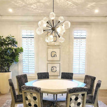 Load image into Gallery viewer, Gem Starburst LED Chandelier in dining room.