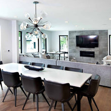 Load image into Gallery viewer, Gem Starburst LED Chandelier in dining room.