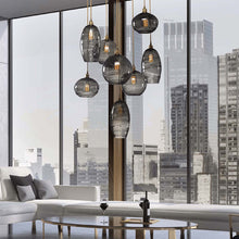 Load image into Gallery viewer, Misto Round Multi Light Pendant Light in living room.