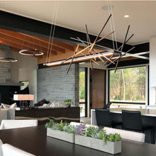Load image into Gallery viewer, Cascade LED Pendant Light in living room.