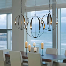 Load image into Gallery viewer, Cirque Chandelier in dining room.