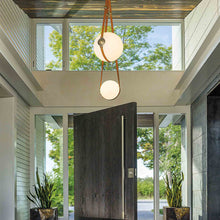 Load image into Gallery viewer, Derby Multi LED Pendant Light in living room.