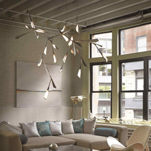 Load image into Gallery viewer, Quill LED Pendant Light in living room.