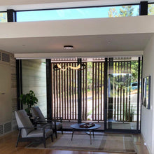 Load image into Gallery viewer, Zephyr LED Pendant Light in living room.