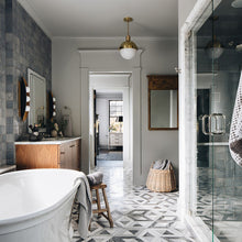 Load image into Gallery viewer, Hopper Wall Light in bathroom.