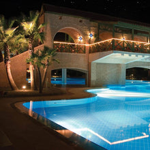 Load image into Gallery viewer, InvisiLED Outdoor RGB Color Changing 24V LED Tape Light in outside area.