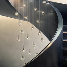 Load image into Gallery viewer, Dew LED Chandelier in stairs.