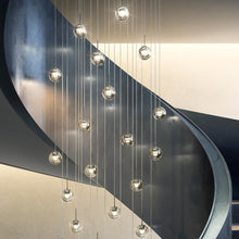 Load image into Gallery viewer, Dew LED Multi Light Pendant Light in stairs.