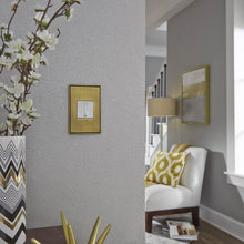 Load image into Gallery viewer, adorne® Cast Metals Wall Plate in living room.