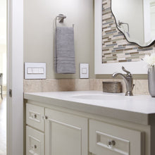 Load image into Gallery viewer, adorne® Pop-Out Outlet in bathroom.