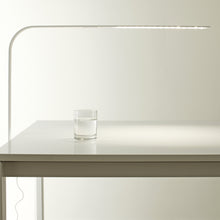Load image into Gallery viewer, LIM C LED Table Lamp in office.