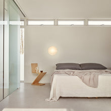 Load image into Gallery viewer, AJ Eklipta Wall Light in bedroom.