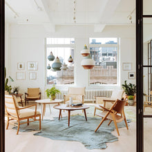 Load image into Gallery viewer, Cirque Pendant Light in living room.