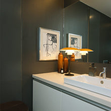 Load image into Gallery viewer, PH 3½-2½ Table Lamp in bathroom.
