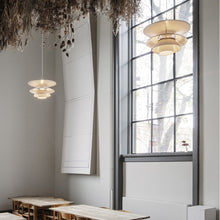 Load image into Gallery viewer, PH 5-4½ Pendant Light in restaurant.