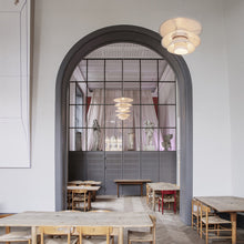 Load image into Gallery viewer, PH 5-4½ Pendant Light in restaurant.
