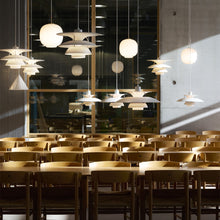 Load image into Gallery viewer, PH 5-4½ Pendant Light in restaurant.