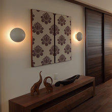 Load image into Gallery viewer, PH Hat Wall Light in living room.
