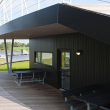 Load image into Gallery viewer, Skot LED Wall Light in Outside Area.