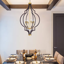 Load image into Gallery viewer, Crest Chandelier in living room.