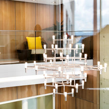 Load image into Gallery viewer, Crown Magnum LED Chandelier in living room.