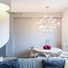 Load image into Gallery viewer, Crown Major LED Pendant Light in living room.