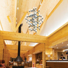 Load image into Gallery viewer, Crown Summa LED Chandelier in restaurant.