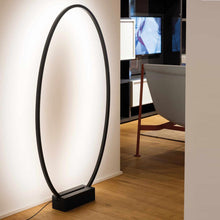 Load image into Gallery viewer, Ellisse Floor Lamp in living room.
